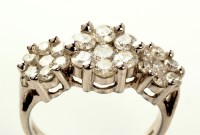 Lot 842 - A triple cluster diamond ring, each of the...