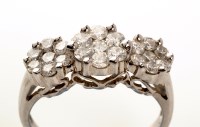 Lot 843 - A triple cluster diamond ring, set with three...