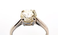 Lot 845 - A brilliant cut solitaire diamond ring, in...