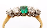 Lot 851 - A five stone emerald and diamond ring, the...