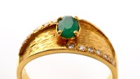 Lot 854 - An green stone and diamond ring, the central...