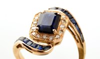 Lot 855 - A blue stone and diamond ring, the central...