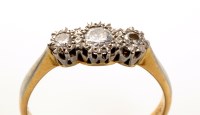 Lot 856 - A three stone diamond ring, each of the...