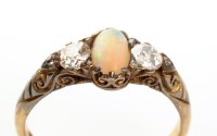 Lot 860 - An opal and diamond ring, the central oval...