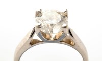 Lot 862 - A brilliant cut solitaire diamond ring, four...