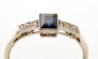 Lot 872 - A sapphire and diamond ring, the square step...