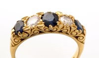 Lot 874 - A five stone sapphire and diamond ring, the...