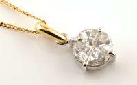 Lot 884 - A diamond pendant, set with four triangular...