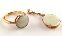 Lot 887 - An opal pendant, the oval opal four claw set,...