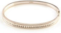 Lot 888 - A diamond set 18ct. white gold bangle, set...