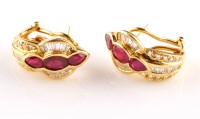 Lot 889 - A pair of ruby and diamond earrings, each set...