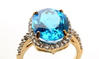 Lot 901 - A blue topaz and diamond cluster ring, the...