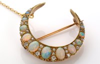 Lot 902 - An opal and diamond crescent-shaped brooch,...