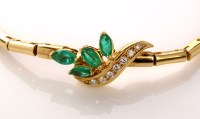 Lot 903 - An emerald, diamond and 18ct. yellow gold...