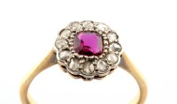 Lot 919 - A ruby and diamond cluster ring, the square...