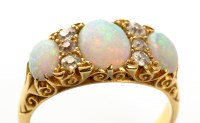 Lot 922 - An opal and diamond ring, the three graduated...