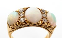 Lot 924 - An opal and diamond ring, the three graduated...