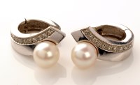 Lot 925 - A cultured pearl, diamond and white metal pair...