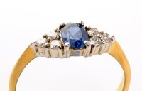 Lot 928 - A sapphire and diamond ring, the central oval...