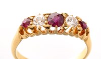 Lot 929 - A five stone ruby and diamond ring, the three...