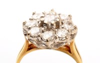 Lot 930 - A diamond cluster ring, set with nine...