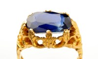 Lot 931 - A sapphire ring, the oval facet cut sapphire...