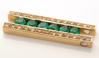 Lot 934 - An emerald and diamond pendant, set with six...