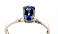 Lot 943 - A single stone tanzanite ring, the oval facet...