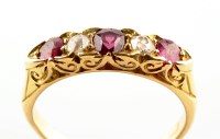 Lot 946 - A ruby and diamond ring, the three graduated...