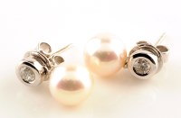 Lot 948 - A pair of diamond and cultured pearl drop...