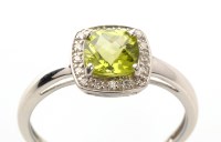 Lot 957 - A peridot and diamond ring, the square facet...