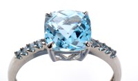 Lot 959 - An aquamarine ring, the square facet cut...