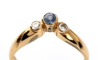 Lot 961 - A sapphire and diamond ring, the circular...