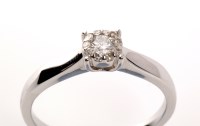 Lot 965 - A diamond cluster ring, the central brilliant...