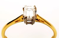 Lot 969 - An emerald cut diamond ring, weighing...