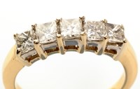 Lot 970 - A five stone diamond ring, each of the...