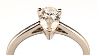 Lot 975 - A single stone diamond ring, the pear cut...