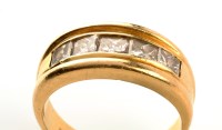 Lot 977 - A five stone diamond ring, the slightly...