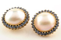 Lot 978 - A pair of Mabe pearl and sapphire cluster...