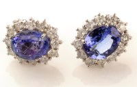 Lot 980 - A pair of tanzanite and diamond cluster...