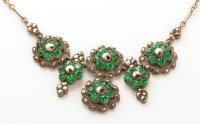 Lot 983 - A green stone and marcasite set pendant...