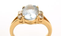 Lot 991 - An aquamarine and diamond ring, the oval facet...