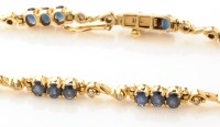 Lot 994 - A sapphire and diamond bracelet, set with...