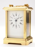 Lot 1276 - A modern brass carriage clock, the enamel dial...