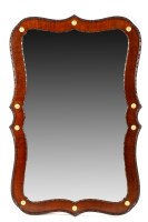 Lot 1292 - A 20th Century mahogany shaped wall mirror,...