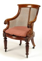 Lot 1322 - A George IV mahogany bergere armchair, with...