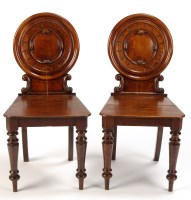 Lot 1327 - A pair of Victorian oak hall chairs, with...