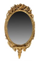 Lot 1338 - A 19th Century oval gilt gesso wall mirror...