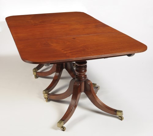 Lot 1344 - A George III mahogany three-pedestal dining...