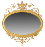 Lot 1347 - An oval bevelled gilt frame Adam style wall...